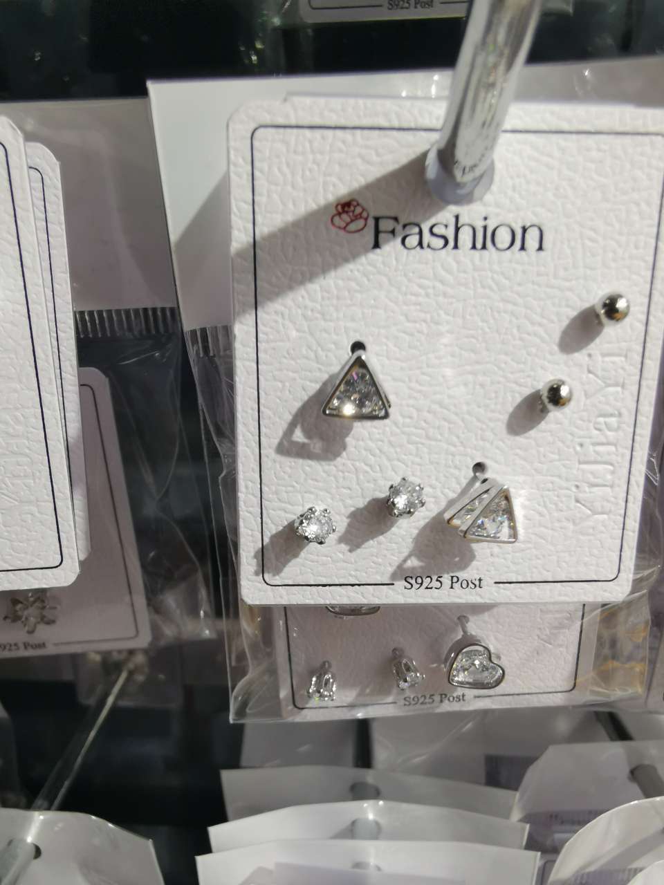 Three pairs of small triangular ear studs