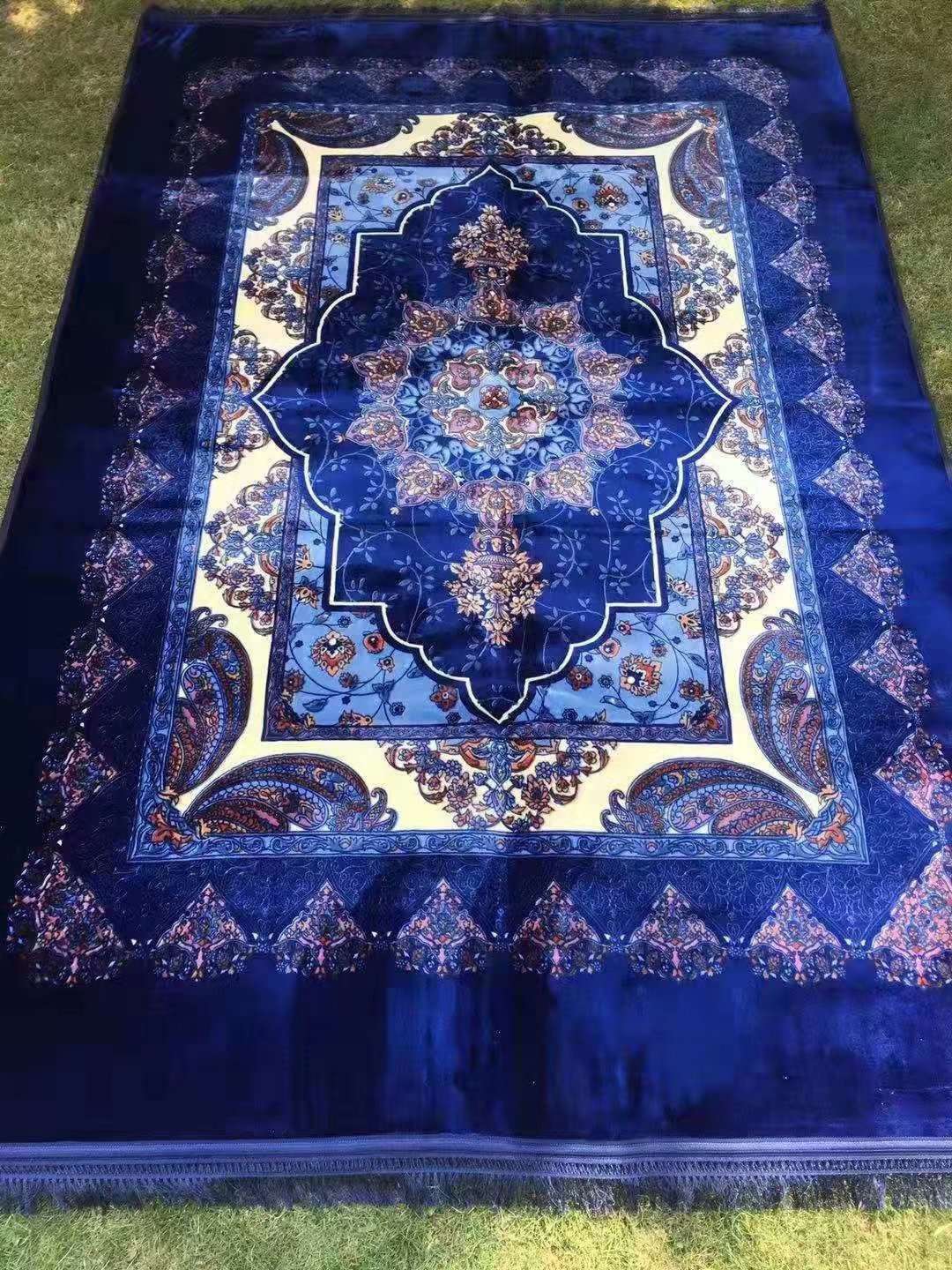 The bedding is a Muslim-printed carpet and a prayer carpet undefined