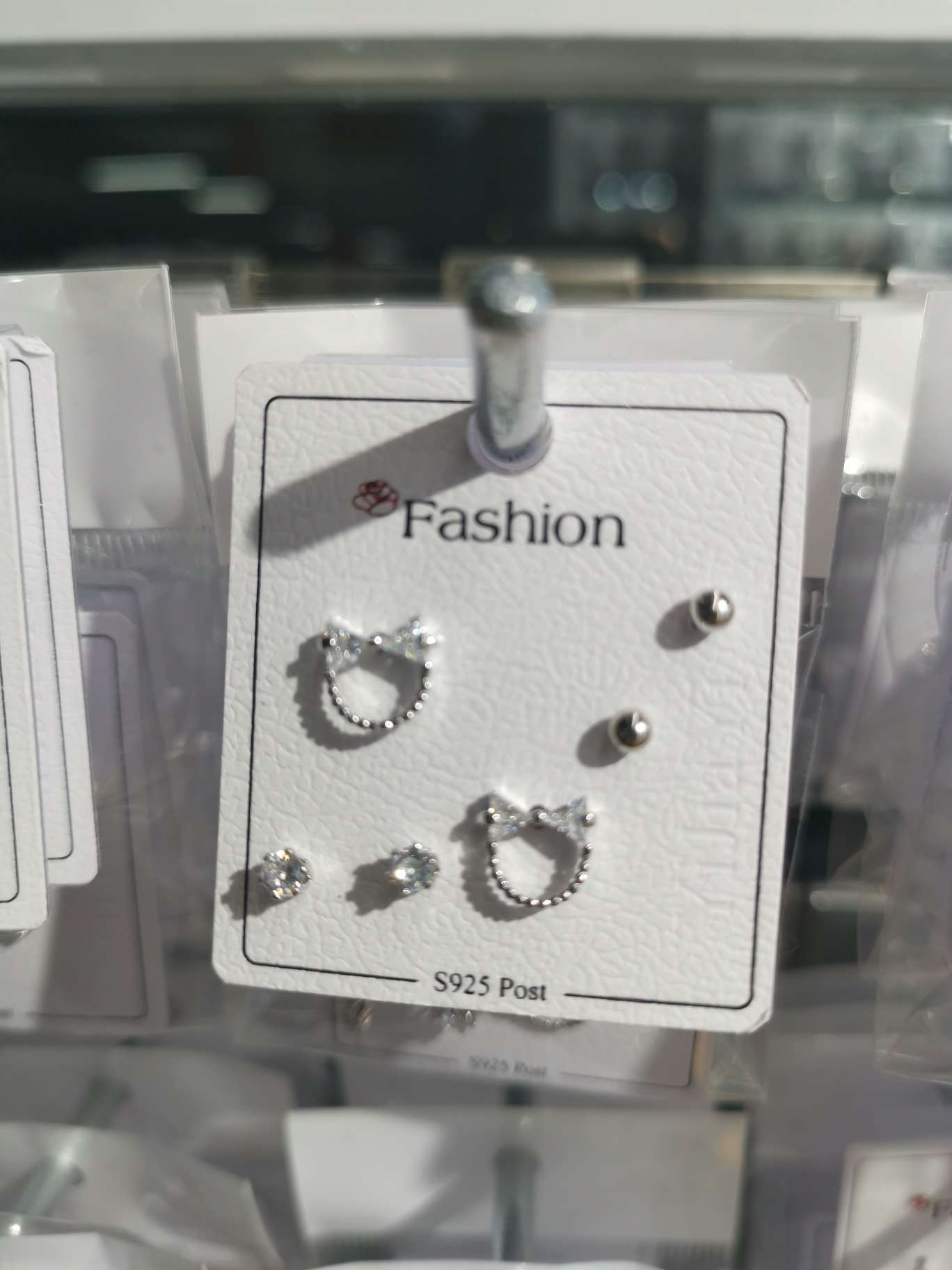 Three pairs of stud earrings for a bow tie
