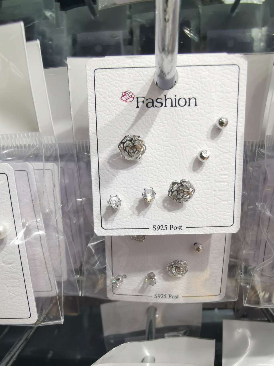 Three pairs of small plum blossom ear studs