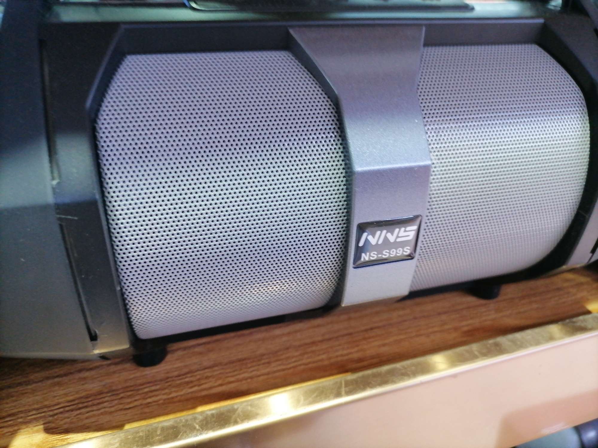 Black speaker with mobile phone