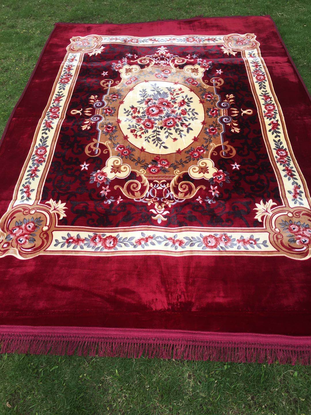 The bedding is a Muslim-printed carpet and a prayer carpet undefined
