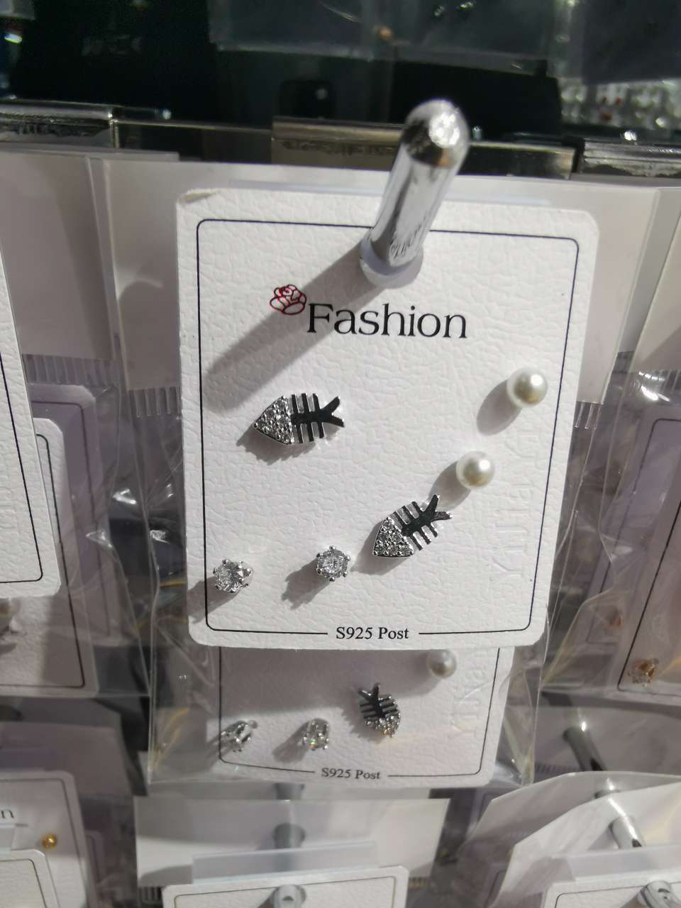 Three pairs of small fishbone ear studs