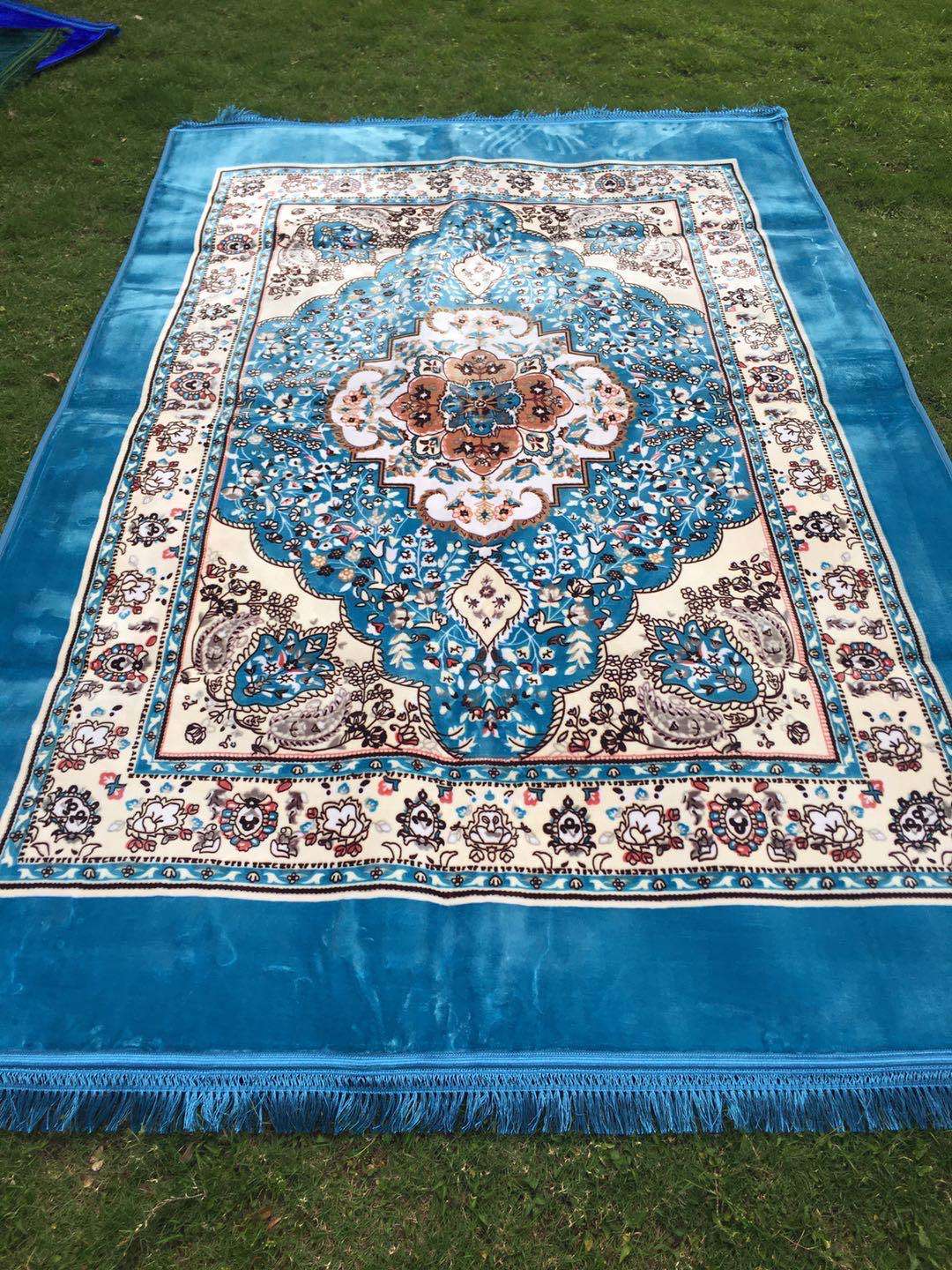 The bedding is a Muslim-printed carpet and a prayer carpet undefined