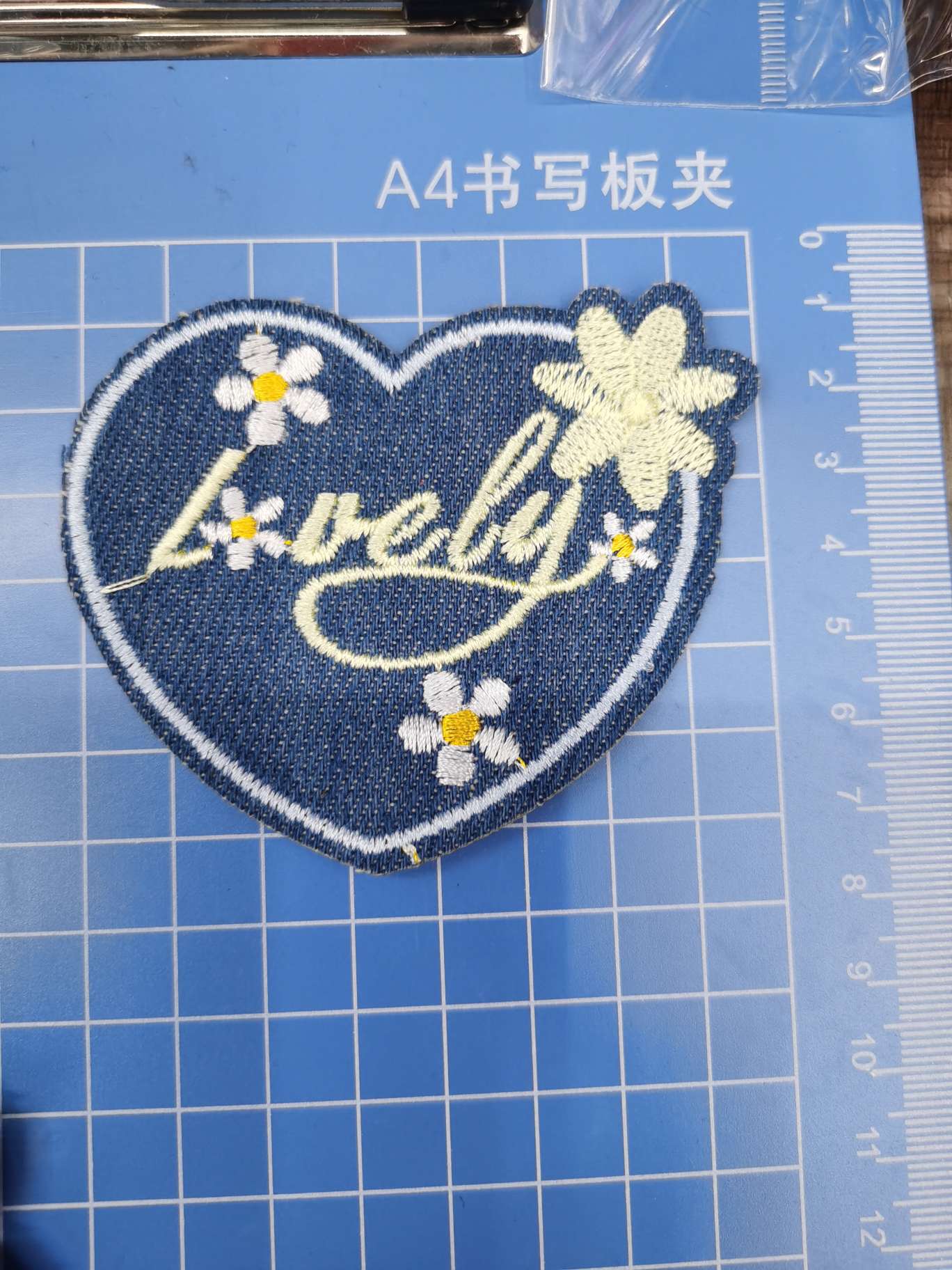 Embroidered butterfly hearts on denim Embroidered butterfly hearts on denim