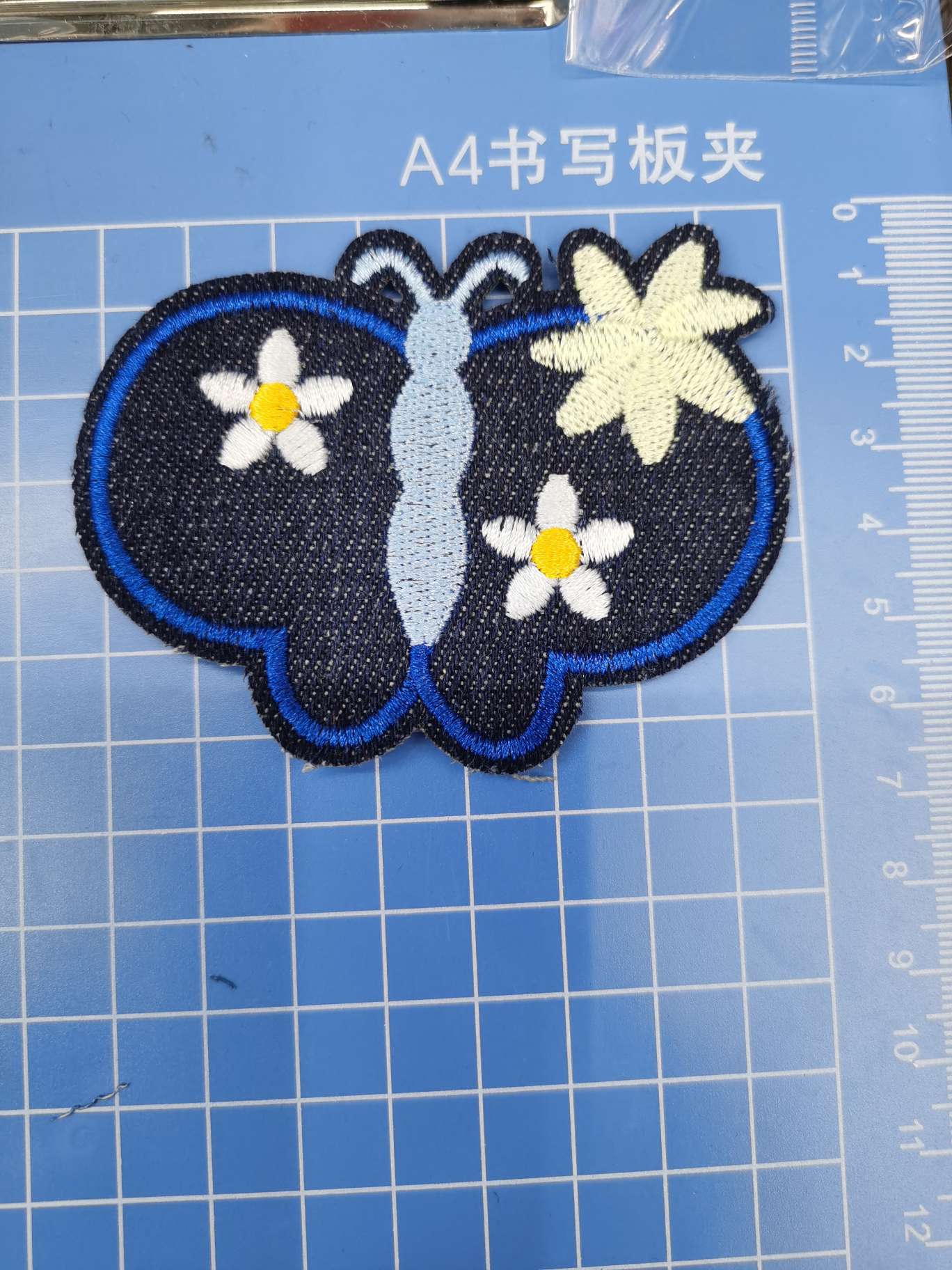 Embroidered butterflies on denim