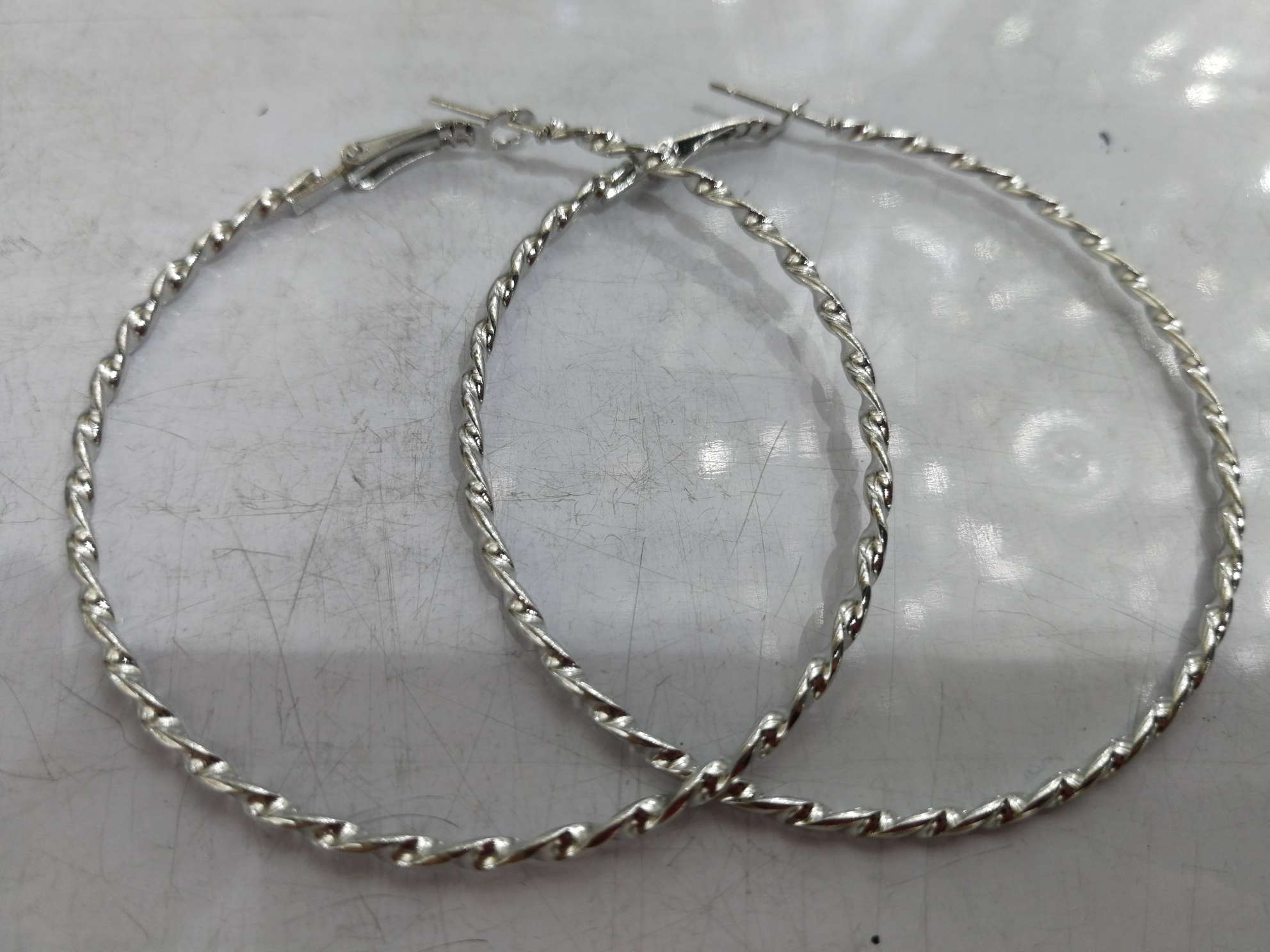 60 threaded white K earrings thumbnail