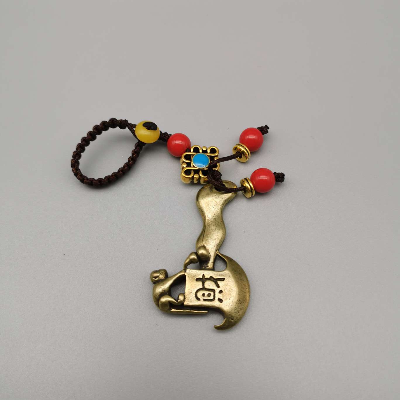 Copper keychain, copper monkey axe, God of Wealth, antelope, elephant, qilin, sika deer, coiled dragon God, Buddha's hand Item Picture