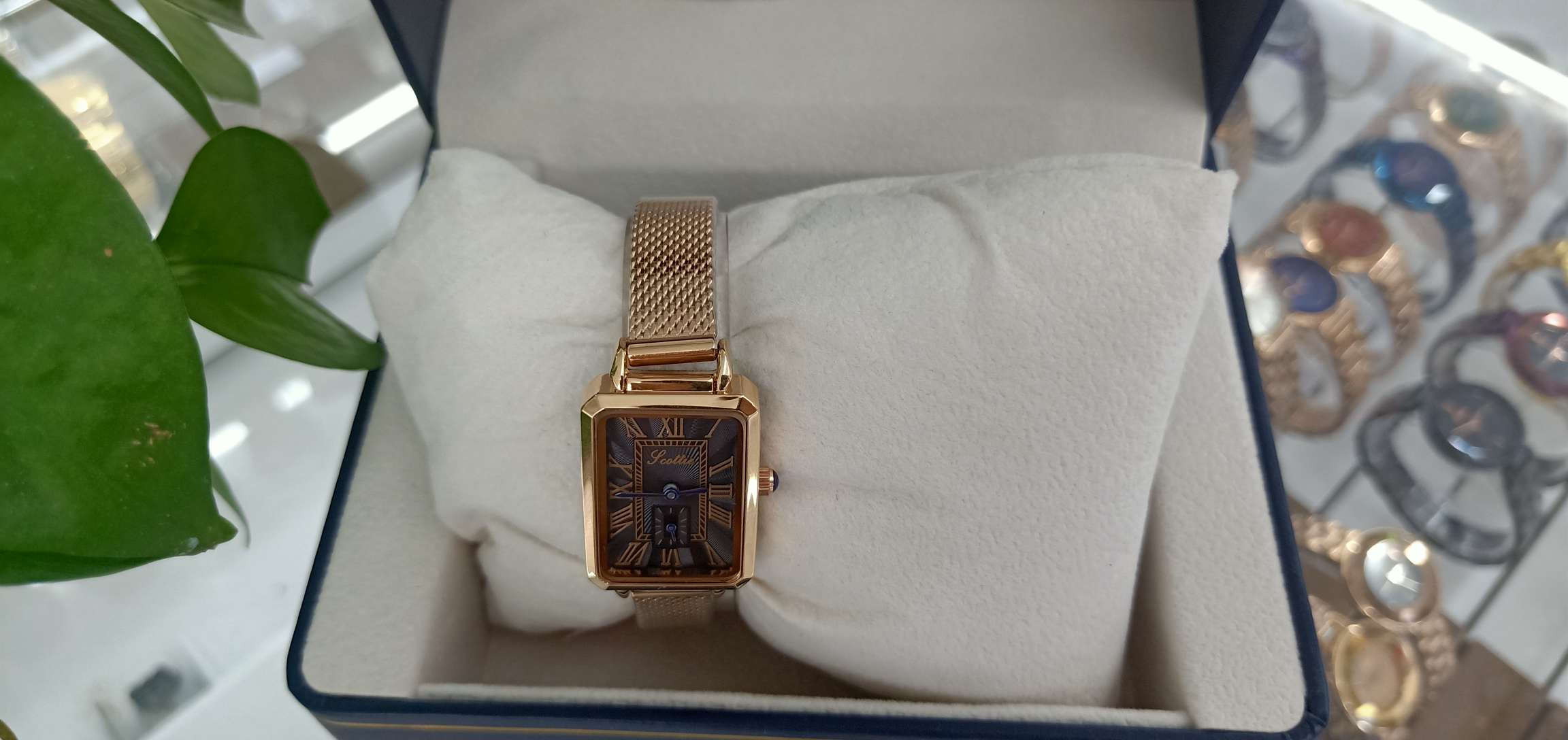 A classic watch with black pattern and yellow chain Specification image