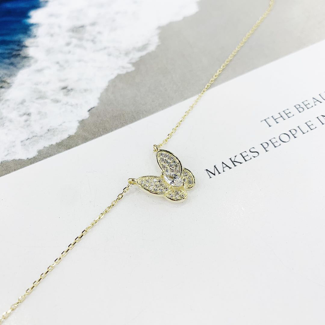 The s925 silver micro-studded butterfly necklace is non-allergenic in white and rose gold undefined