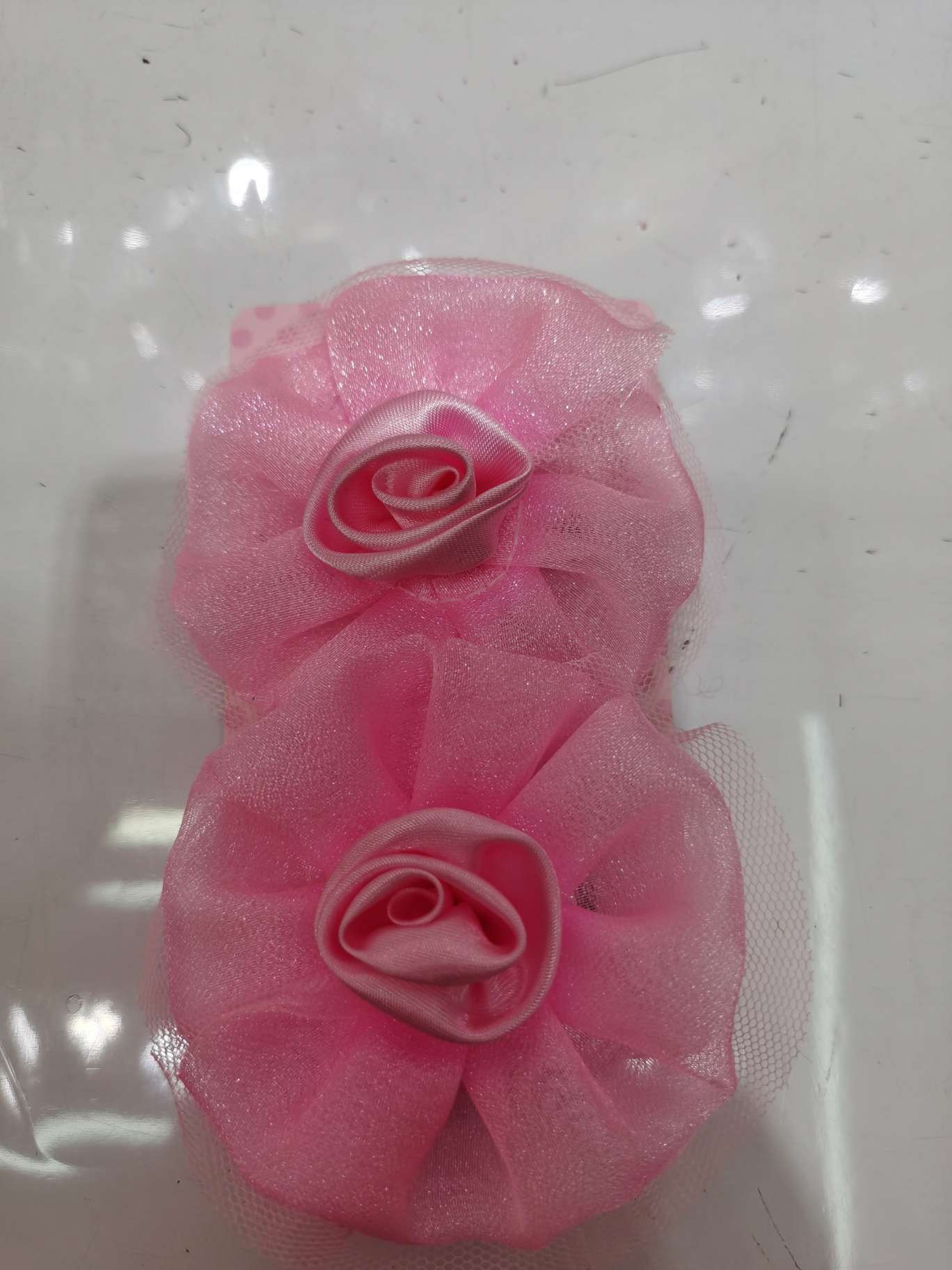 Highlight the fabric flower on the clip