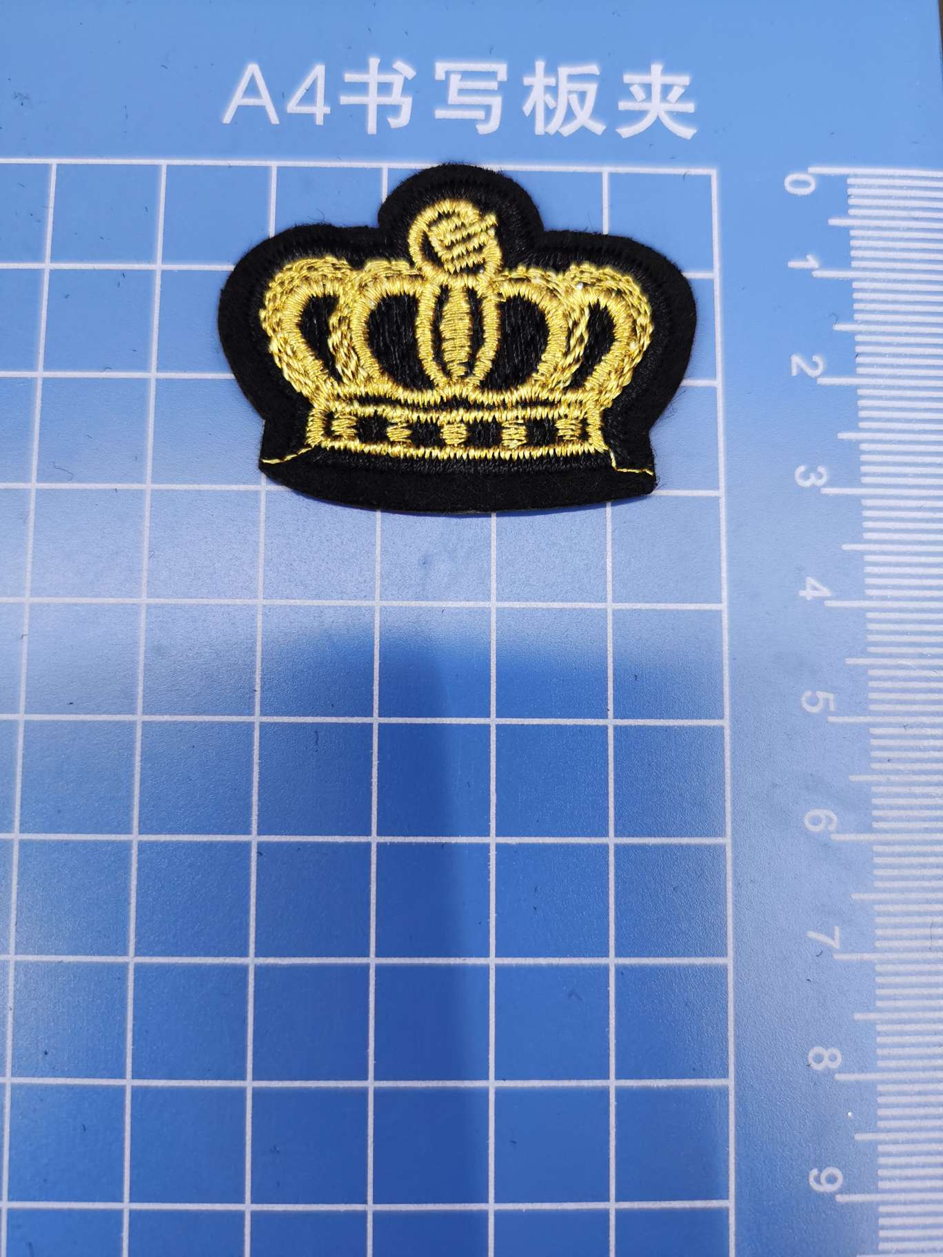 A small crown made of golden thread