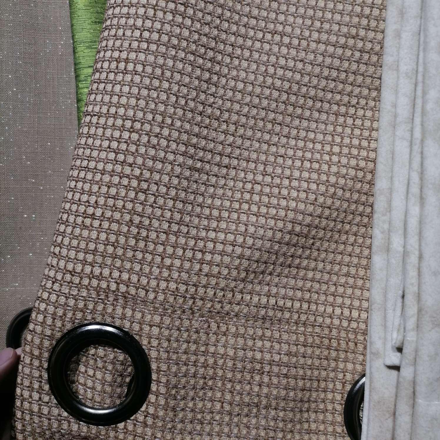 The perforated curtains are brown
