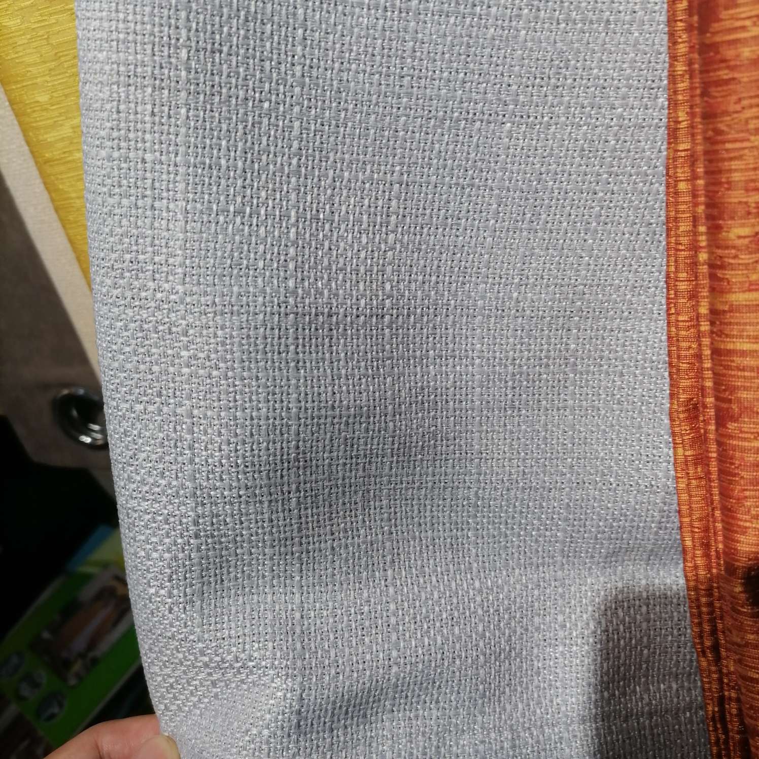 Perforated curtains made of linen in grey