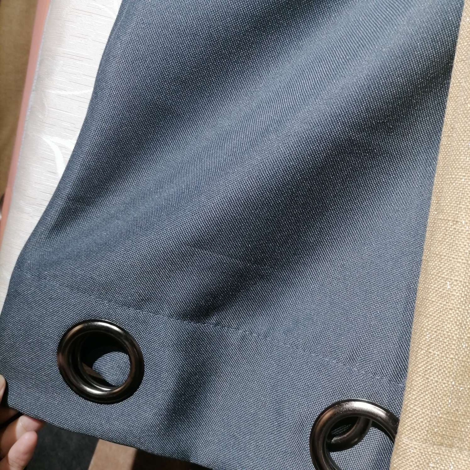 Perforated curtains in black and gray