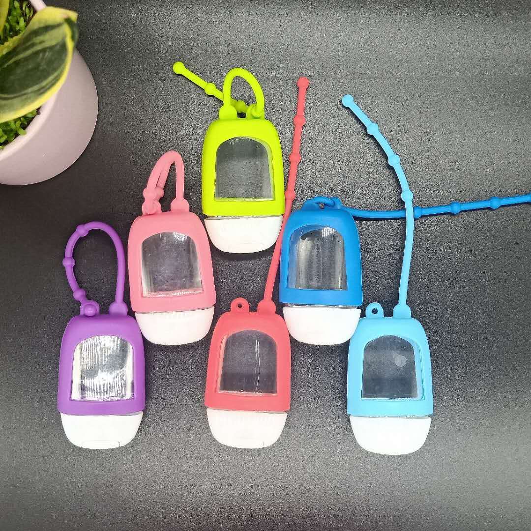 Portable hand sanitizer bottle