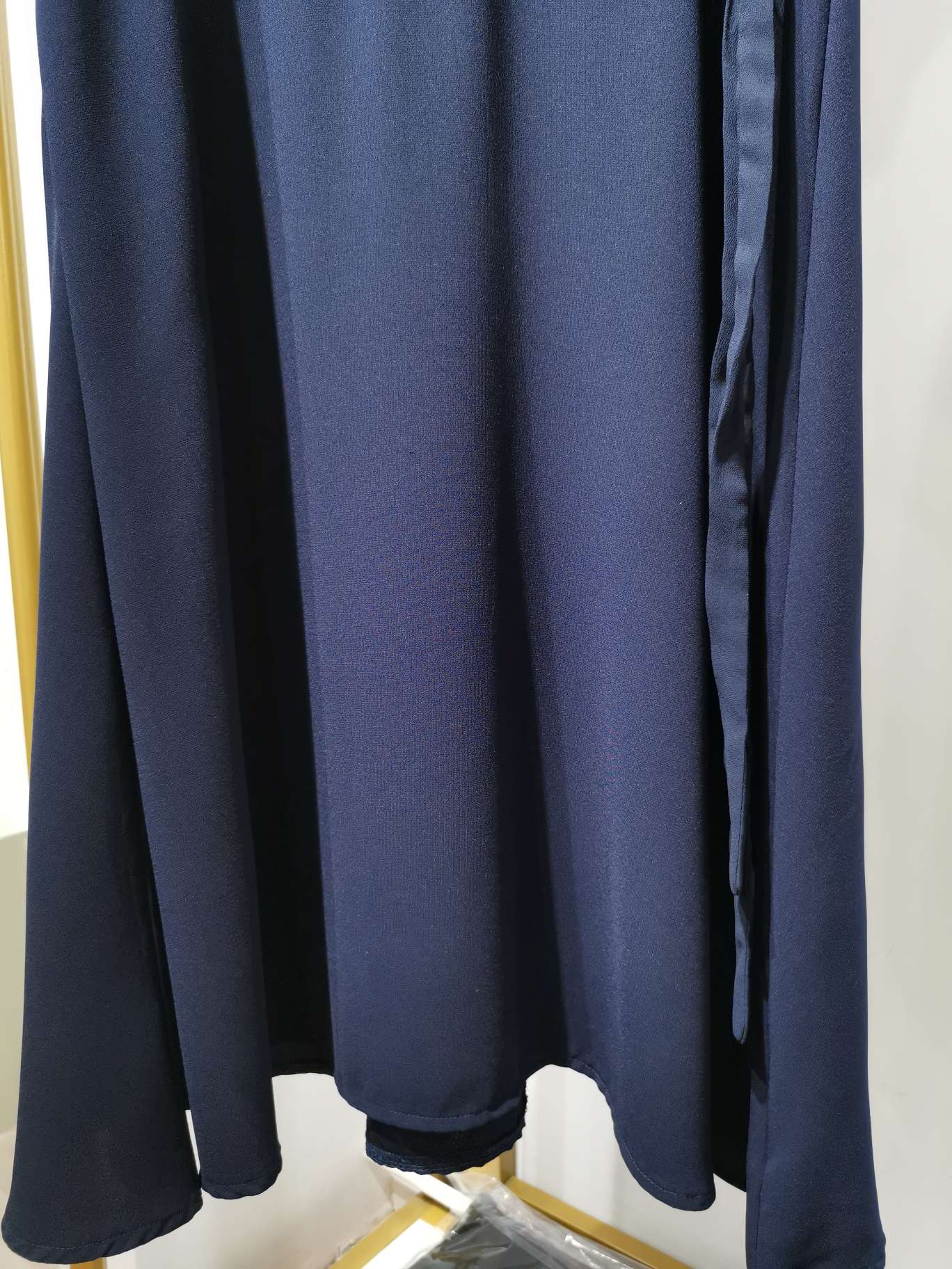 A fashionable V-neck cinched women's dress in bright blue with clear lines Specification image