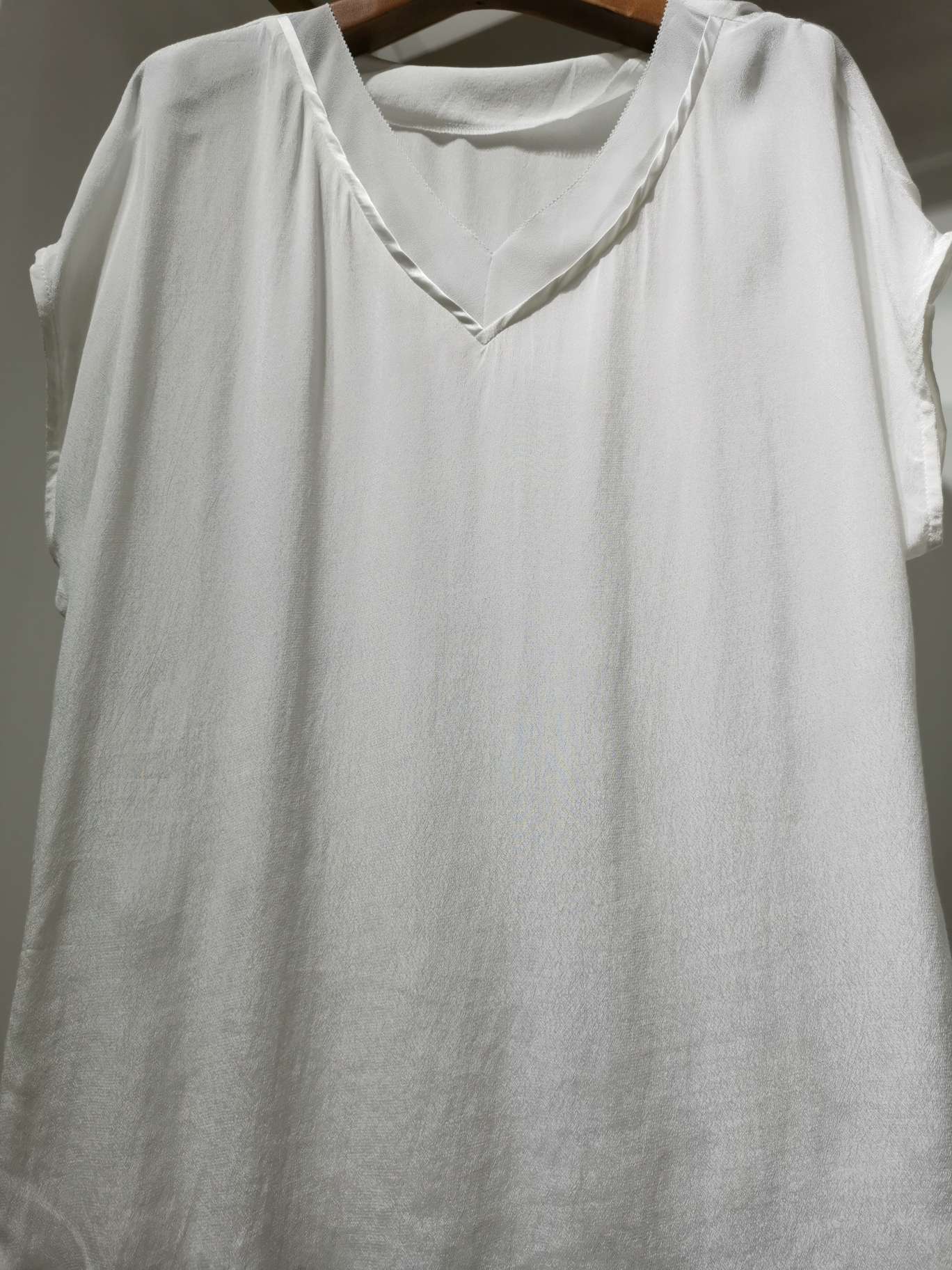 A white double V-neck fashionable casual shirt