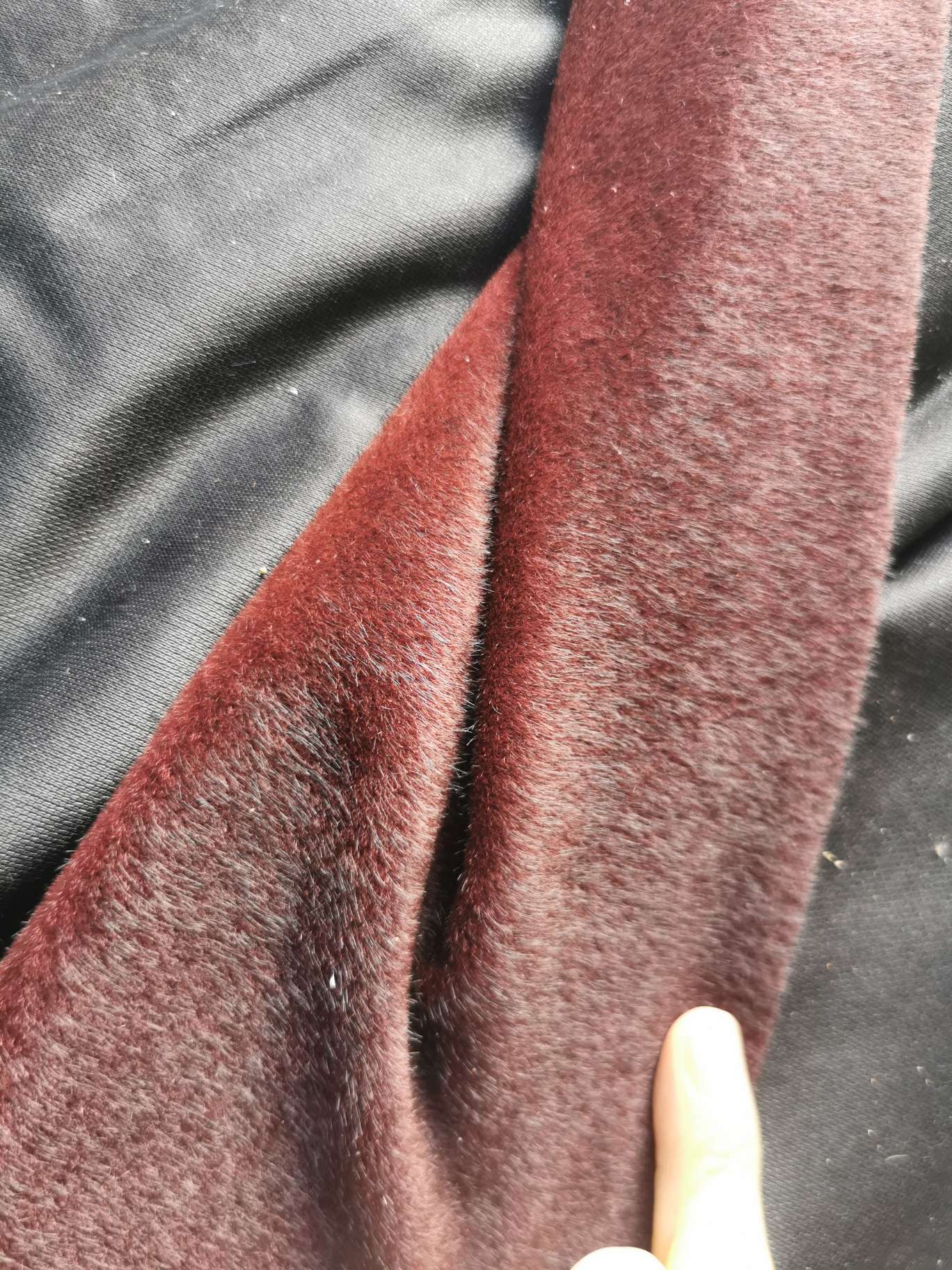 The faux leather mink fur is wine red