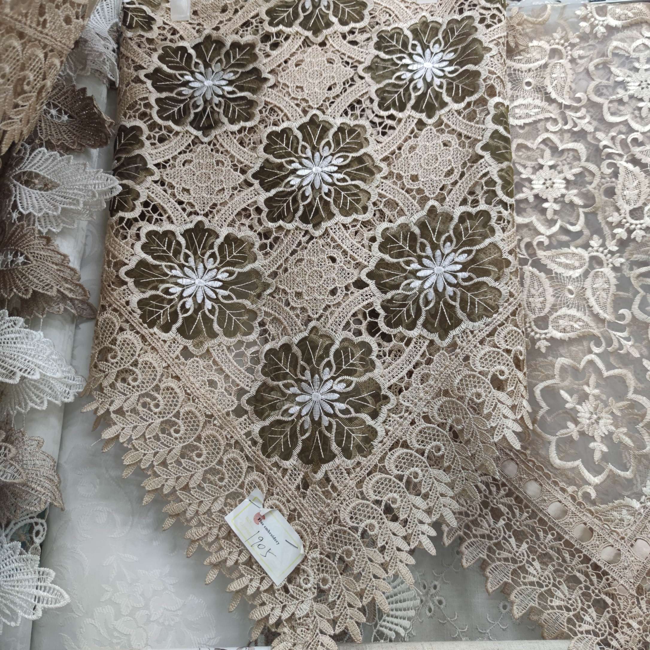 Lace Gold Tablecloth With Yellow Flowers On Table