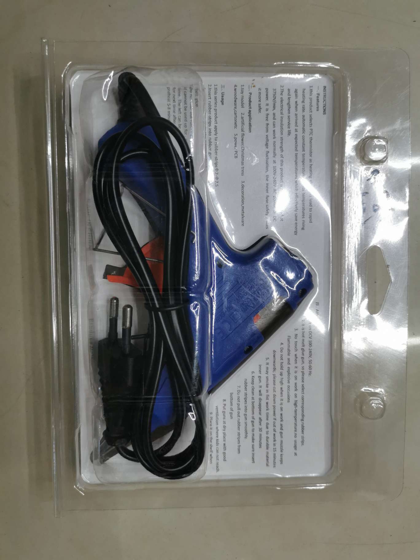 Heavy-duty glue gun in use during home repair