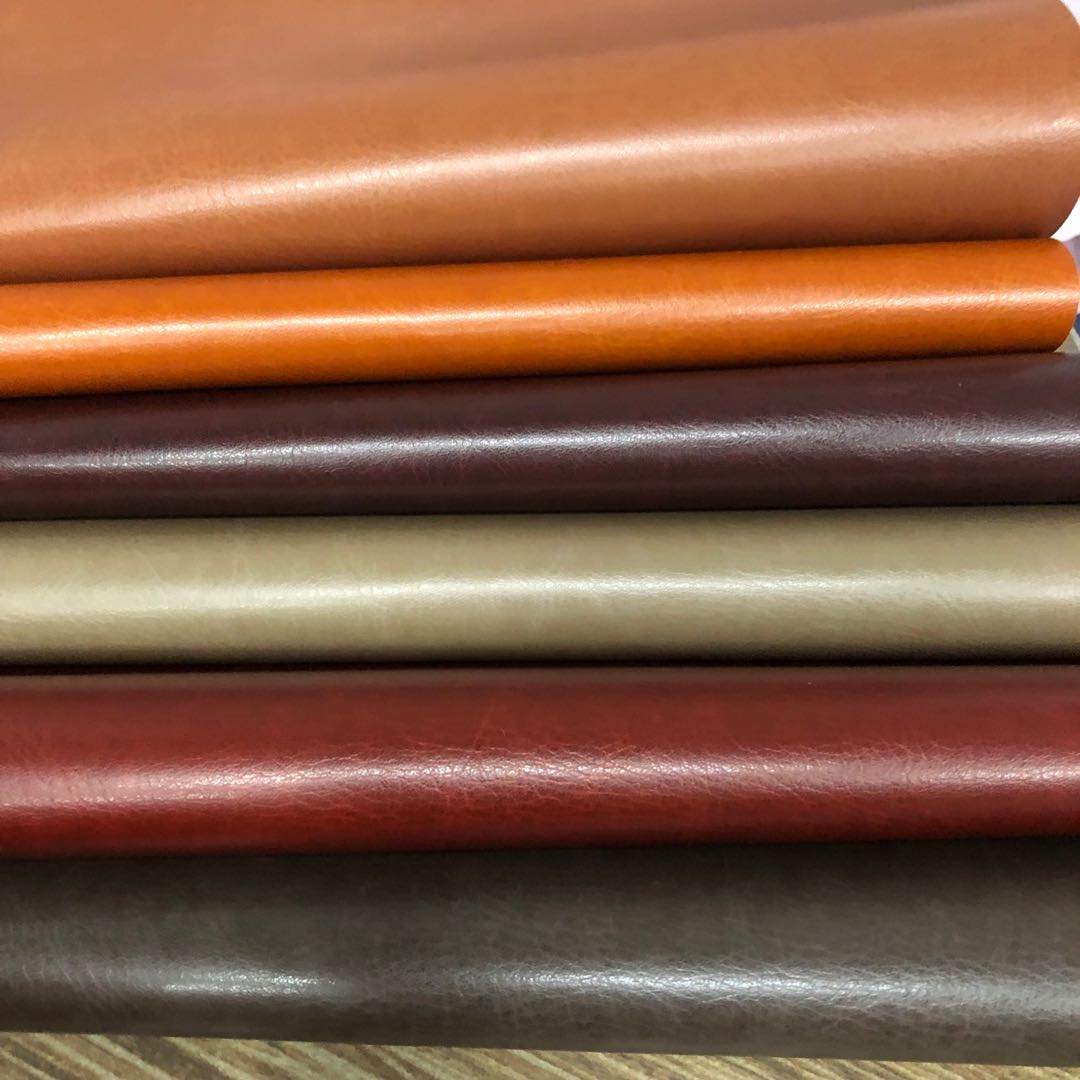 Factory direct sales of pressed PU leather brand leather crystal cowhide bag fabric Item Picture