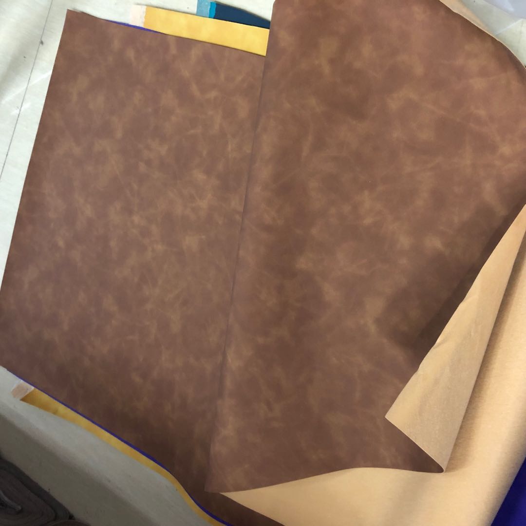 Factory direct sales of new pressure-changed PU color-changing leather with a skin-like feel, dreamy bag leather packaging box, notebook cover leather Item Picture