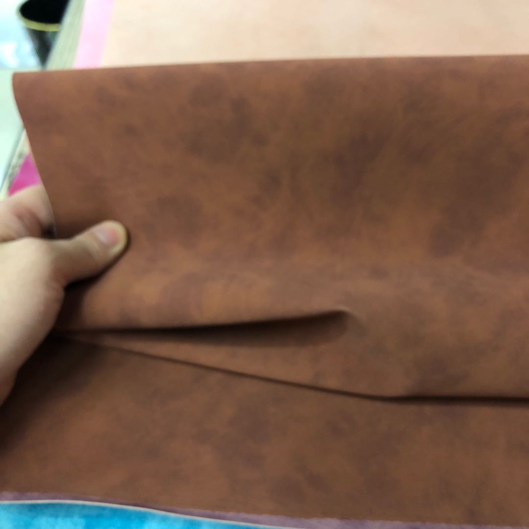 Factory direct sales of PU skin-like velvet surface embossed PU leather bag texture packaging box fabric can be embossed with Logo Specification image