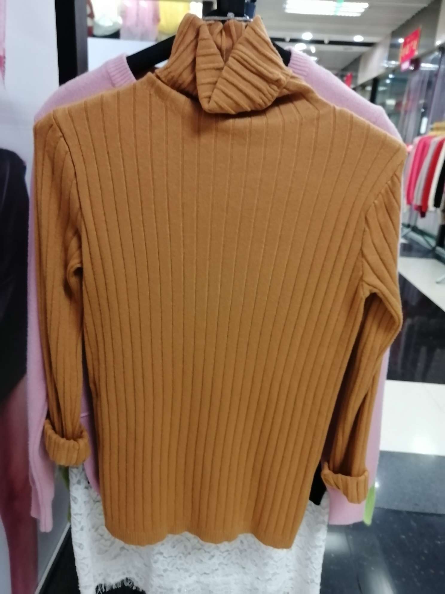 Long neck of lady's warm brown sweater thumbnail