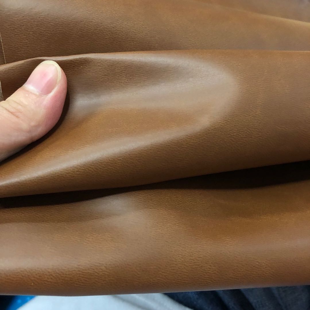 Factory direct sales of small wood grain pu leather fabric, embossed leather color-changing trademark leather bag fabric details Picture