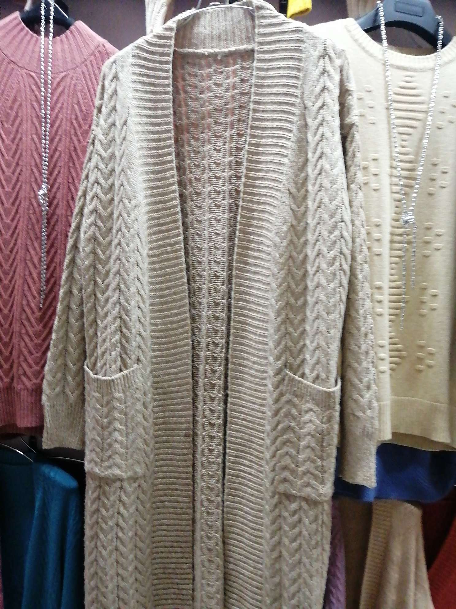 A lady's long sweater coat thumbnail
