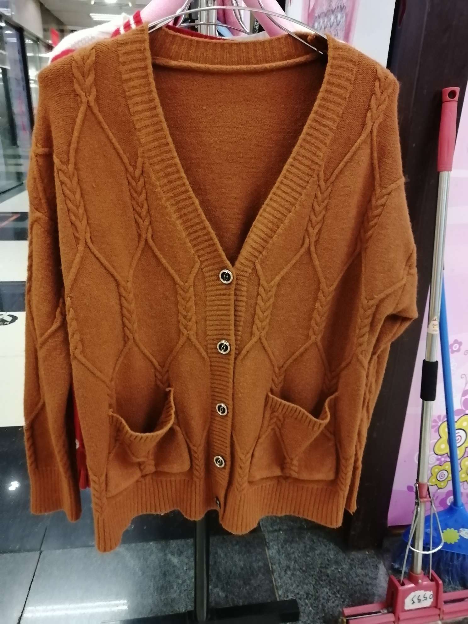 Lady's brown sweater thumbnail