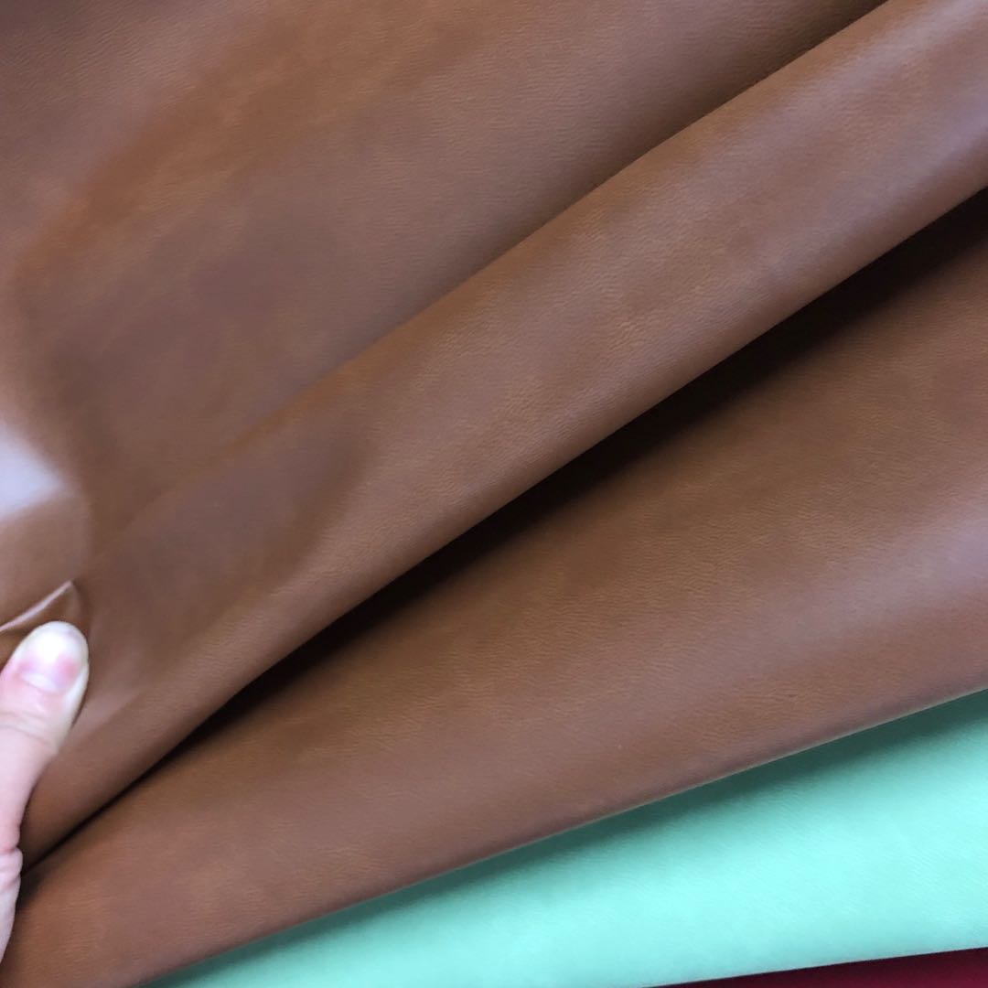 Factory direct sales of small wood grain pu leather fabric, embossed leather color-changing trademark leather bag fabric undefined