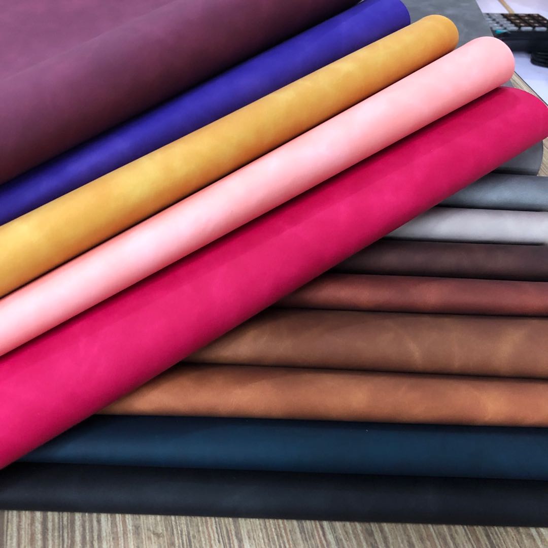 Factory direct sales of new pressure-changed PU color-changing leather with a skin-like feel, dreamy bag leather packaging box, notebook cover leather Application Scenario
