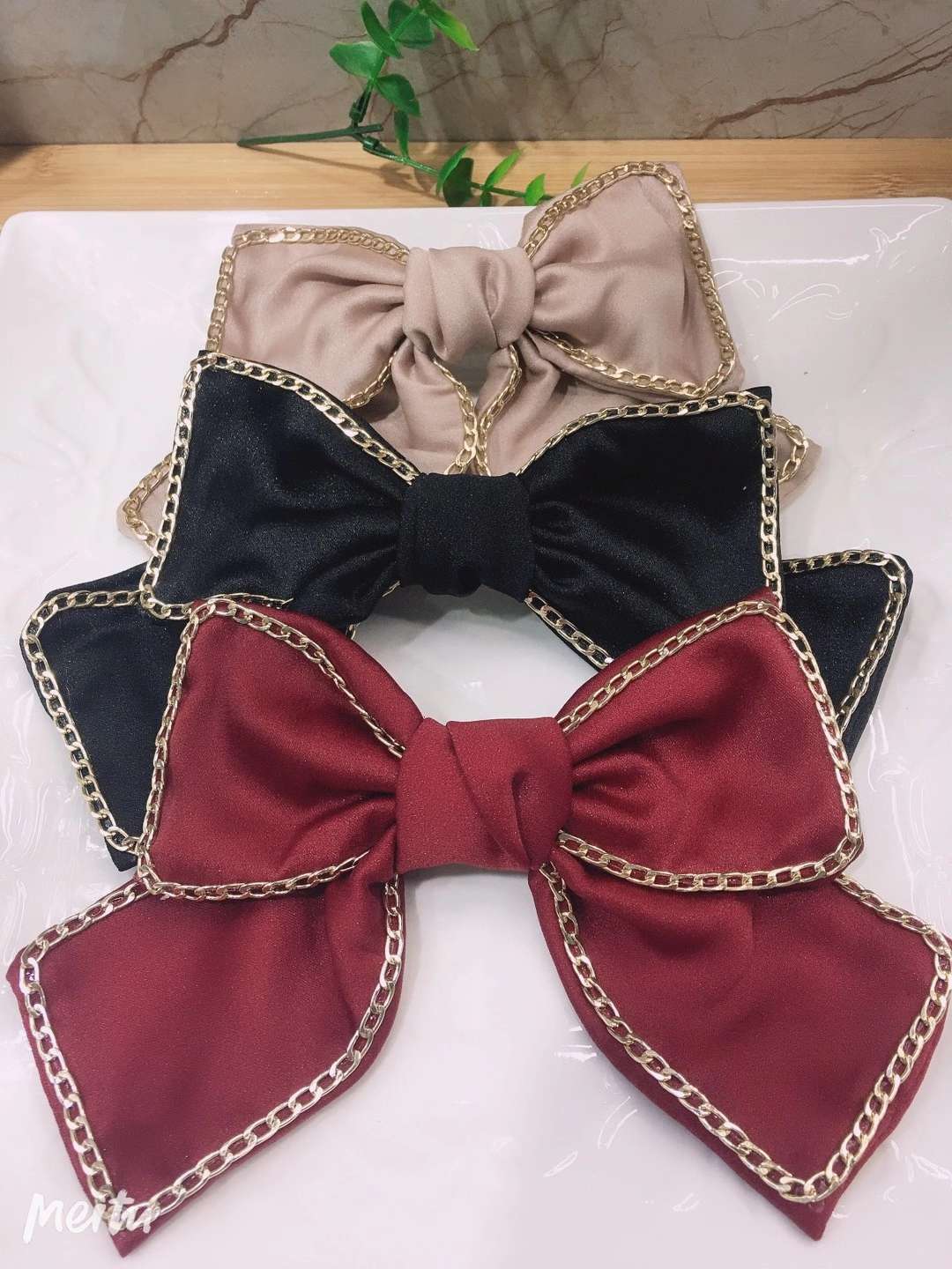 The tie is glued to a metal chain