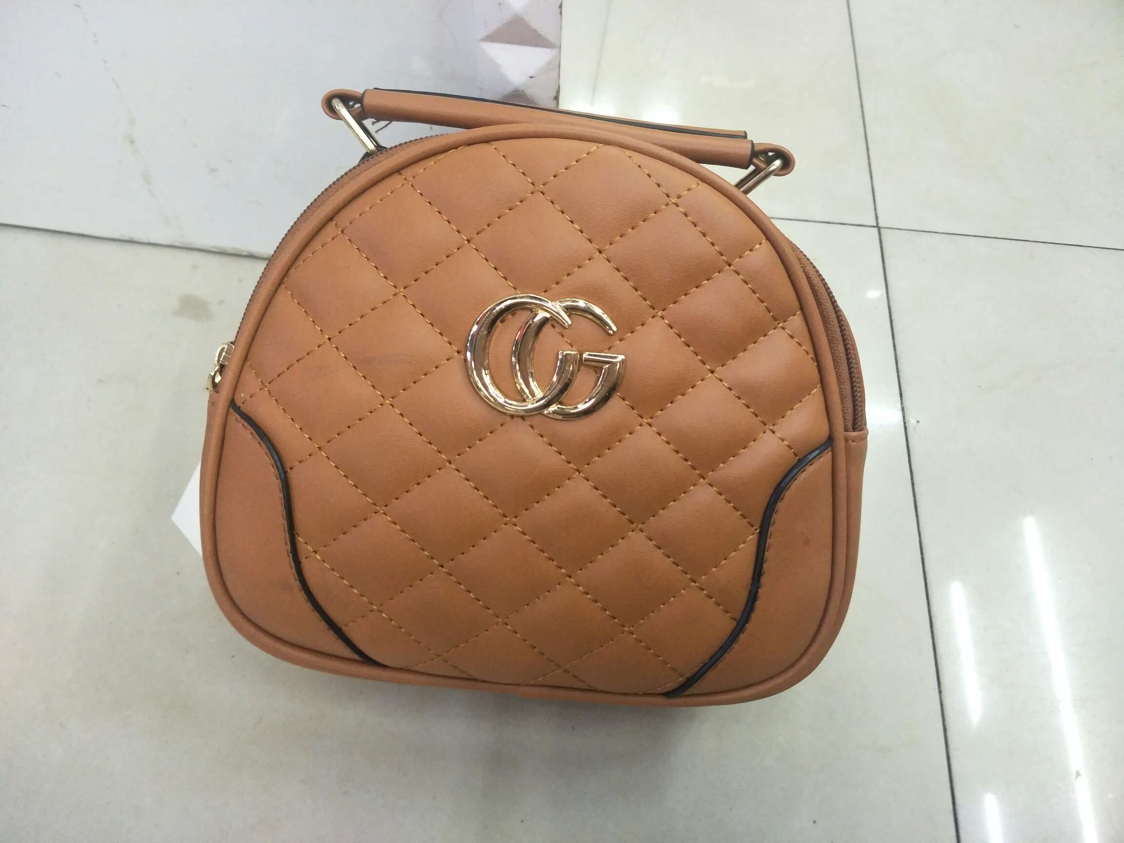 The lady is carrying a shoulder bag