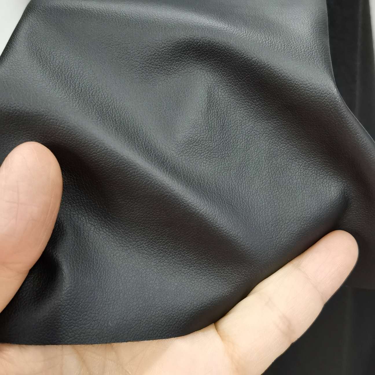 Factory direct sales of matte lambskin texture semi-PU leather fabric elastic clothing leather, black thin style Application Scenario