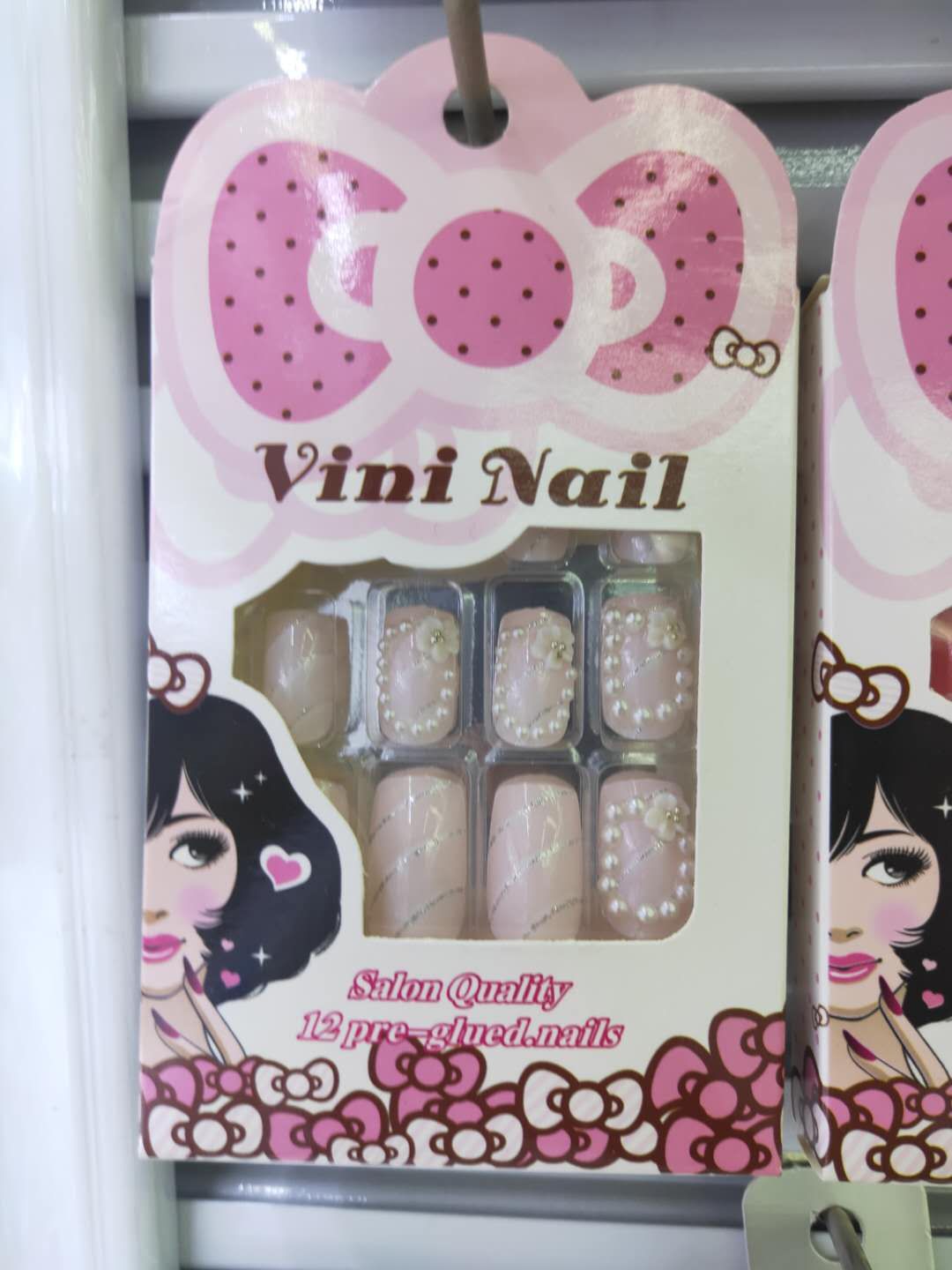 Pink fake nails with drill nails