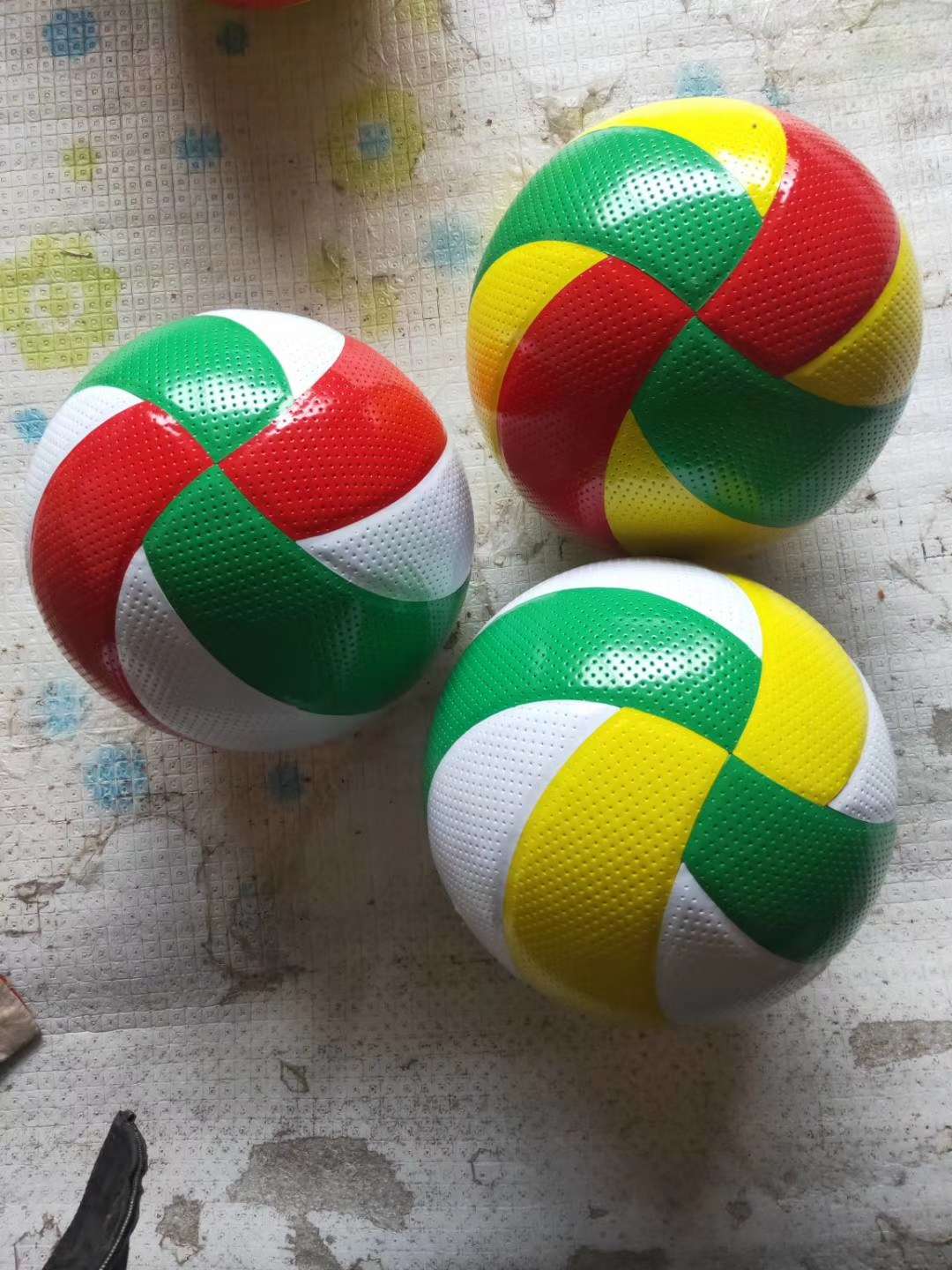 Yellow, white and blue volleyball