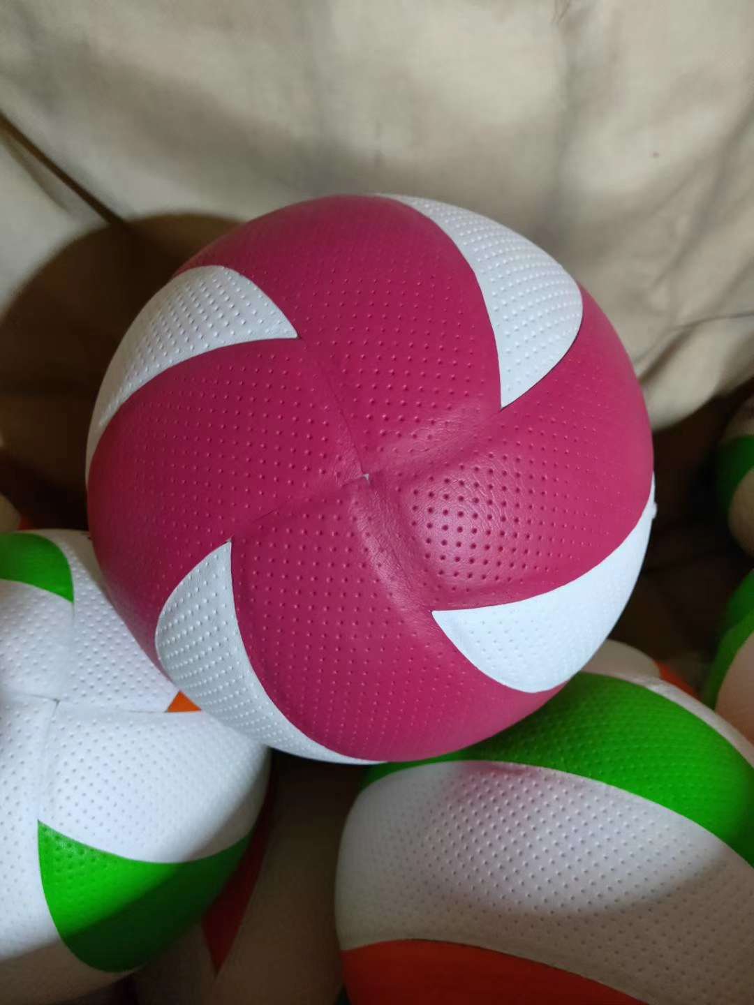 Pink and white volleyball