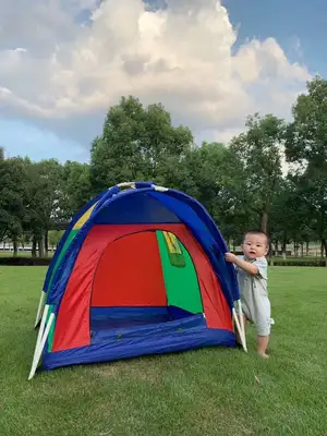 Children camp outdoors in tents thumbnail