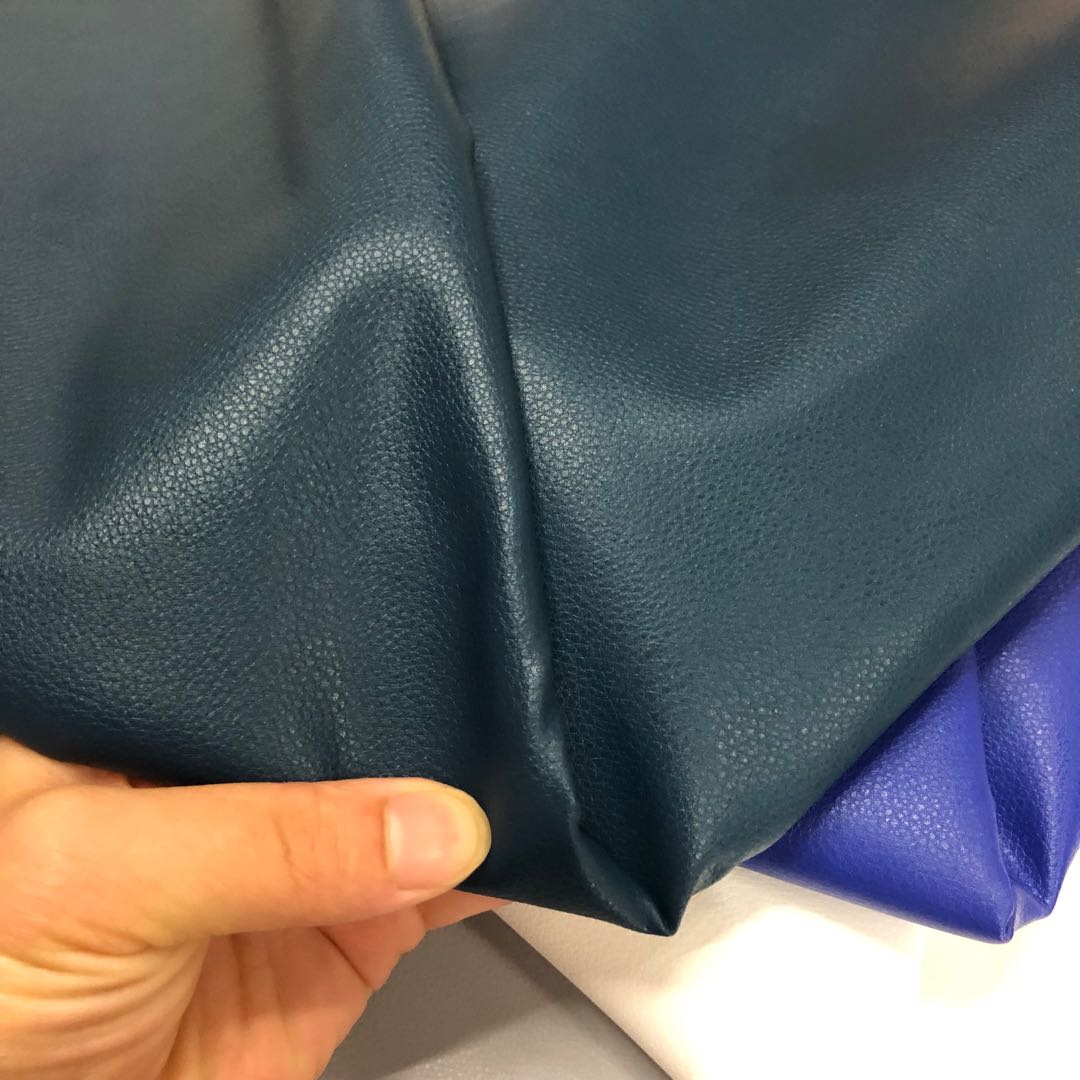 Factory direct sales of faux leather with small litchi patterns, full pu leather and cotton fleece base, 0.7 soft hand feel, bag belt fabric details Picture