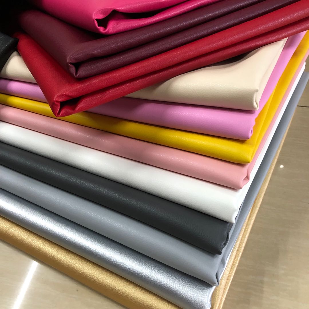 Factory direct sales of faux leather with small litchi patterns, full pu leather and cotton fleece base, 0.7 soft hand feel, bag belt fabric Application Scenario