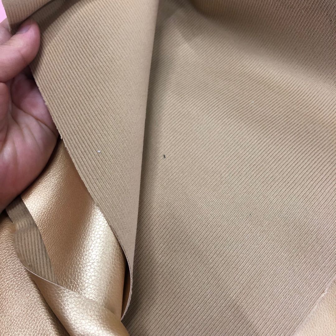 Factory direct sales of faux leather with small litchi patterns, full pu leather and cotton fleece base, 0.7 soft hand feel, bag belt fabric Item Picture