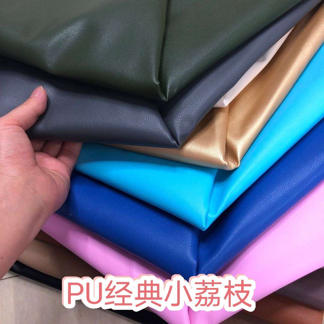Factory direct sales of faux leather with small litchi patterns, full pu leather and cotton fleece base, 0.7 soft hand feel, bag belt fabric undefined