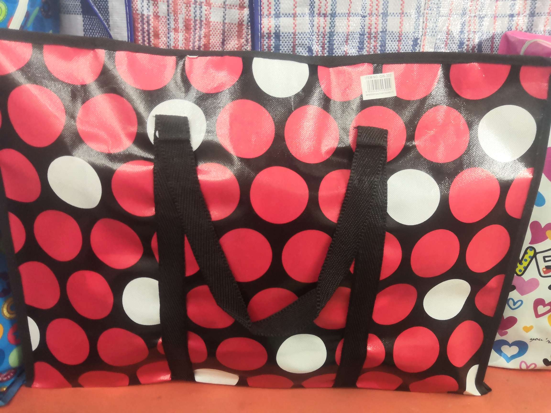 Polka dot red woven bag