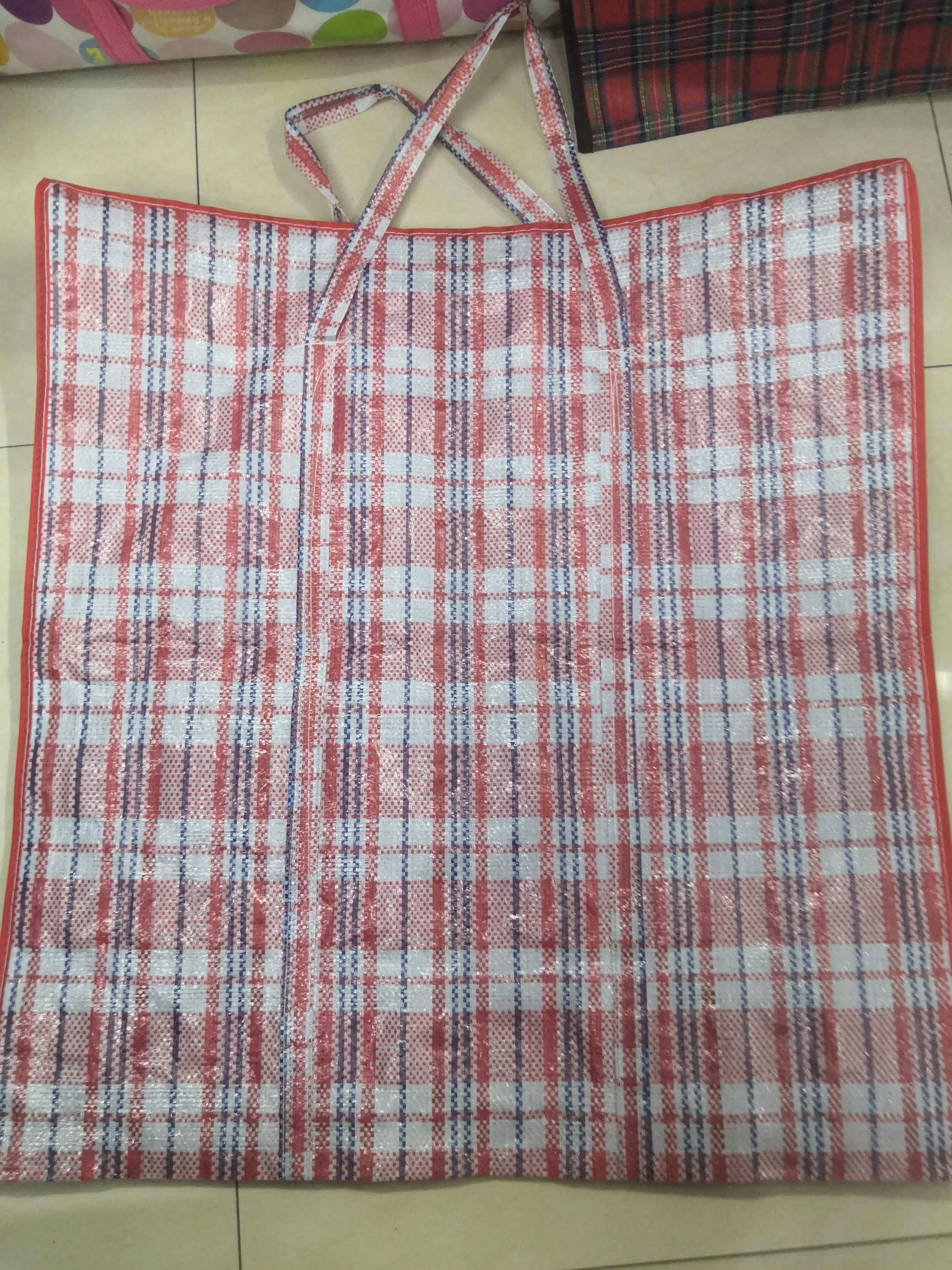 Red checkered woven bag