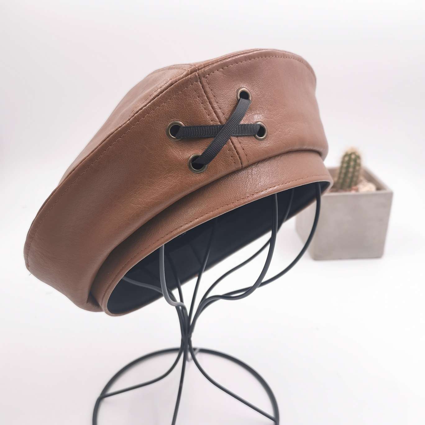 Cross leather berets