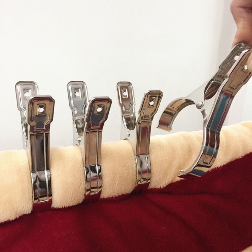 Quilts and bedsheets are fixed with large stainless steel clamps containing five MH-10 thumbnail