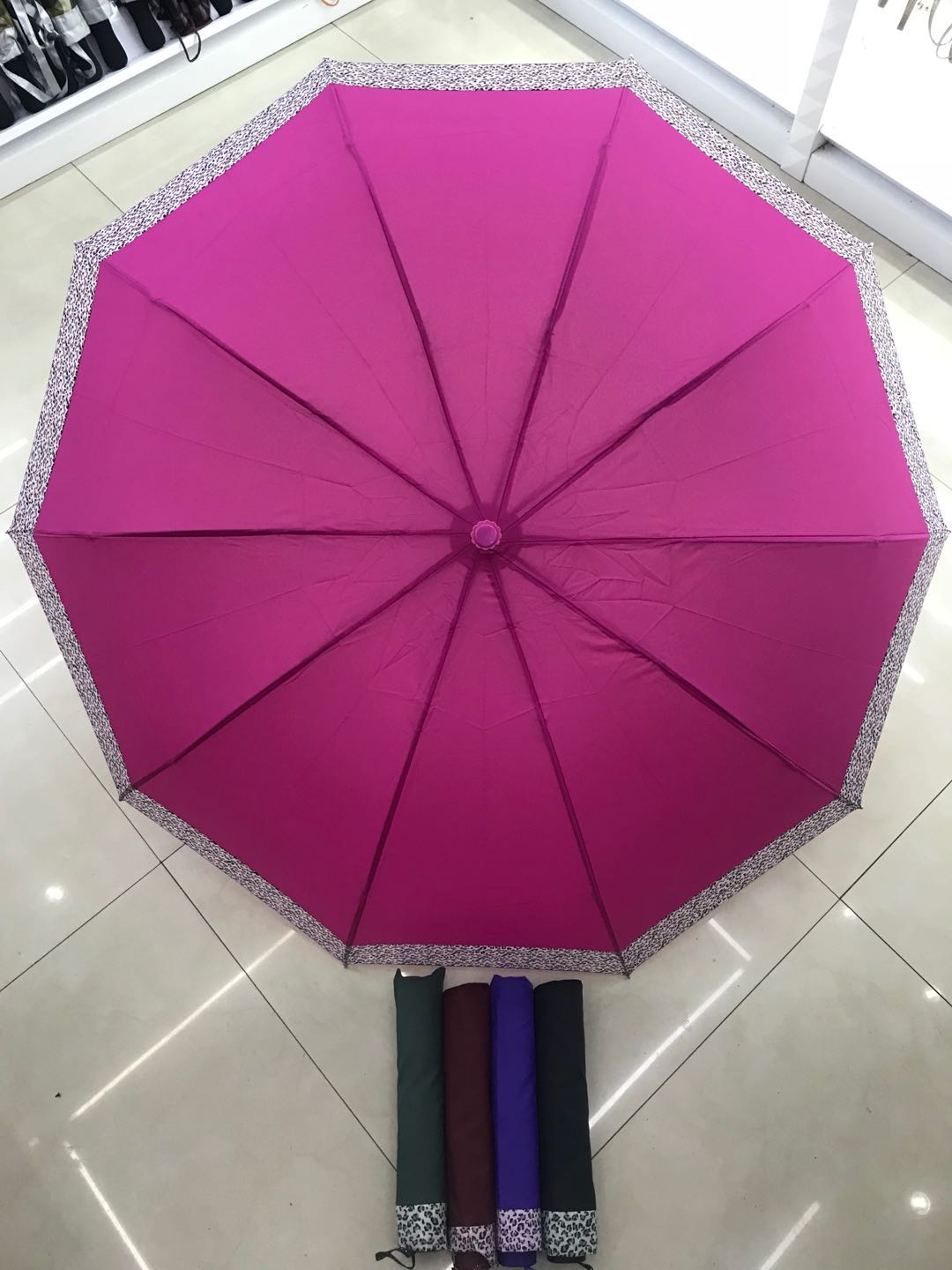 75#10K leopard print solid edge thick-pole folding umbrella, practical and portable three-fold umbrella, ladies' gift sunshade umbrella